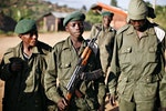 A child soldier stands at the front line in eastern Congo