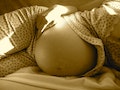 10002-belly-of-a-pregnant-woman-in-sepia-tone-pv