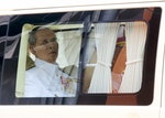 Thailand's King Bhumibol sits in a vehicle as he leaves Siriraj Hospital for the Grand Palace to join a ceremony marking coronation day in Bangkok
