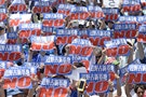 Protesters raise placards during a rally to oppose the transfer of a key U.S. military base within the prefecture, at a baseball stadium in the prefectural capital Naha on Japan's southern island of O