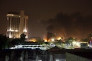 Smoke rises from the site of car bomb attack in Baghdad