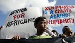 Demostrators march against the recent wave of xenophobic attacks in Khayelitsha township near Cape Town