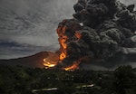Mount Sinabung volcano erupts, as seen from Tiga Pancur village, Karo Regency in Indonesia's North Sumatra province