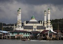 A water taxi crosses in front of the Kampong Tamoi mosque in a water village, home to an estimated 20,000 people, in Bandar Seri Begawan
