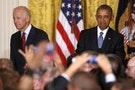 President Obama and VP Biden react as a heckler is removed for an extended interruption of his remarks during a reception to observe LGBT Pride Month in the East Room at the White House in Washington