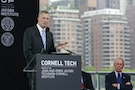 New York City Mayor Bill de Blasio speaks while former New York City mayor Michael Bloomberg looks on during a groundbreaking ceremony of Cornell Tech's campus on Roosevelt Island in New York