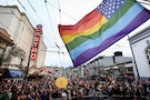 A rainbow-colored U.S. flag flies in front of San Francisco's iconic Castro Theater during a street celebration following the United States Supreme Court's landmark decision that legalized same-sex ma