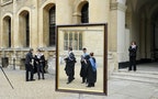 File photograph shows graduates queueing to have their photograph taken after a graduation ceremony at Oxford University in England