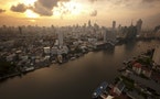 The skyline of central Bangkok and the Chao Phraya river are seen during sunrise in Bangkok