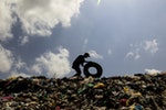 Josue Salazar collects discarded tyres in Masaya's municipal garbage dump