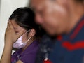 A family member of a victim injured in a fire at the Formosa Fun Coast water park reacts at Taipei Veterans General Hospital in Taipei