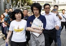 Teen blogger Amos Yee leaves with his parents after his sentencing from the State Court in Singapore