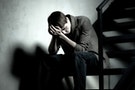 沮喪＿焦慮＿Depressed man sitting on steps in dark corridor