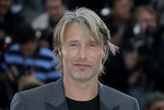 Cast member Mikkelsen poses during a photocall for the film Jagten at the 65th Cannes Film Festival,