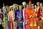 MALAYSIANS IN TRADITIONAL DRESS POSE BEFORE A REHEARSAL IN KUALA LUMPUR.