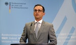 Maas gives a statement to the media at the Ministry of Justice in Berlin