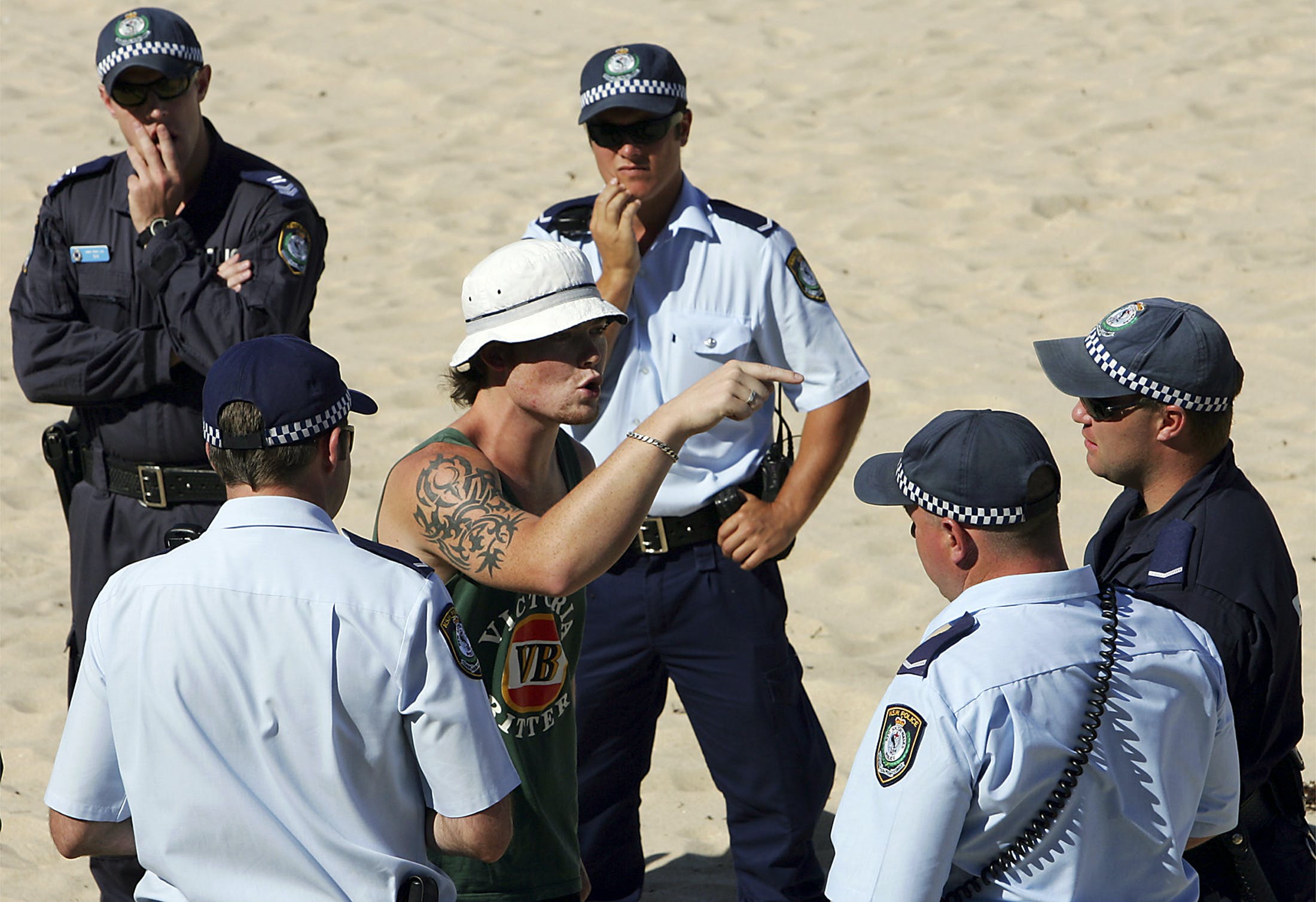 File photo of a man arguing with police before being detained for an alcohol-related incident on North Cronulla Beach in Sydney