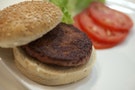 The world's first lab-grown beef burger is seen after it was cooked at a launch event in west London
