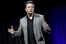 Tesla Motors CEO Elon Musk reveals the Tesla Energy Powerwall Home Battery during an event in Hawthorne, California