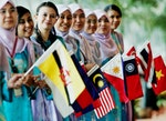 Malaysian girls holding ASEAN countries flags