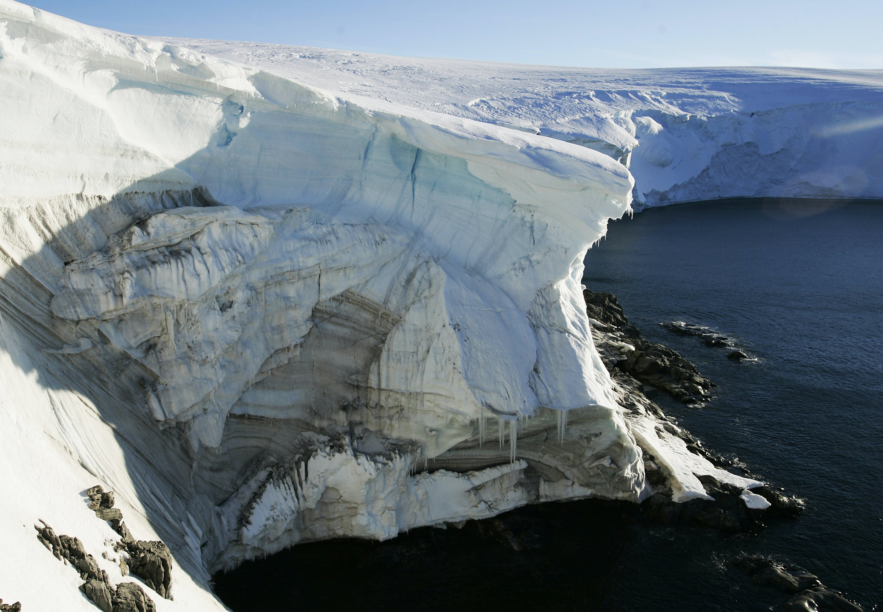 Melting ice shows through at a cliff face at Landsend, on the coast of Cape Denison in Antarctica