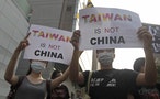 Activists protest against the Singapore meeting between Taiwan's President Ma Ying-jeou and China's President Xi Jinping outside the Ministry of Economic Affairs in Taipei