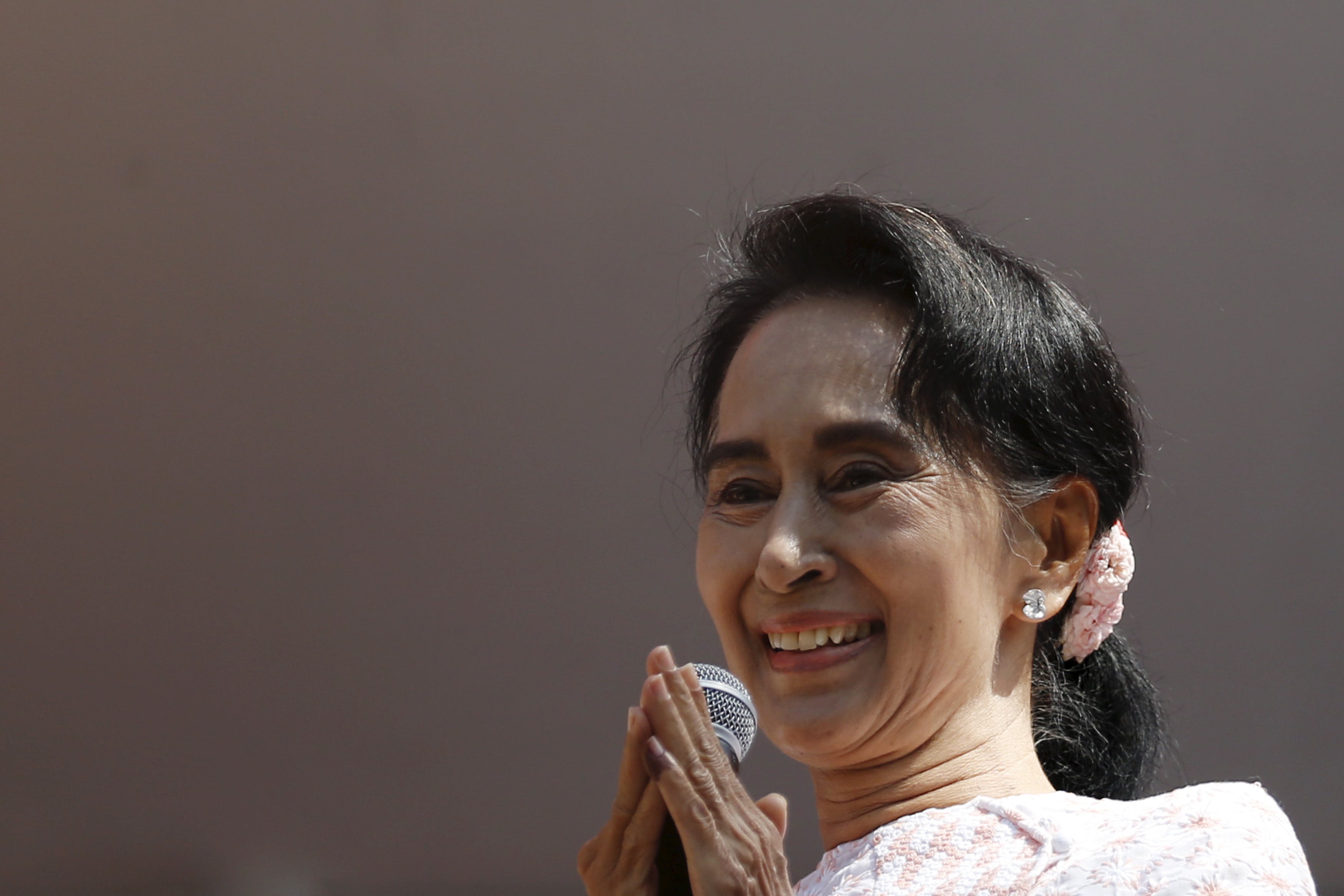 Myanmar's National League for Democracy party leader Suu Kyi talks to supporters after general elections in Yangon