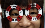 A protester takes part in a demonstration urging the government to provide long-term plans on combating climate change in Hong Kong