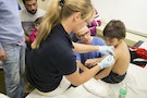 A refugee child from Syria receives a vaccination at Berlin's central registration center for refugees and asylum seekers LaGeSo in Berlin