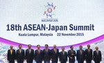 (L-R) Philippines' President Benigno Aquino, Singapore's Permanent Secretary at the Ministry of Foreign Affairs Chee Wee Kiong, Thailand's Prime Minister Prayuth Chan-ocha, Vietnam's Prime Minister Nguyen Tan Dung, Japan's Prime Minister Shinzo Abe, Malaysia's Prime Minister Najib Razak, Laos' Prime Minister Thongsing Thammavong, Brunei's Sultan Hassanal Bolkiah, Cambodia's Prime Minister Hun Sen, Indonesia's President Joko Widodo and Myanmar's President Thein Sein pose for a photograph at the 18th ASEAN - Japan summit during the 27th Association of Southeast Asian Nations (ASEAN) summit in Kuala Lumpur, Malaysia, November 22, 2015. REUTERS/Olivia Harris - RTX1V8XI