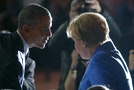 US President Obama talks to German Chancellor Merkel during the opening session of the World Climate Change Conference 2015 (COP21) at Le Bourget, near Paris