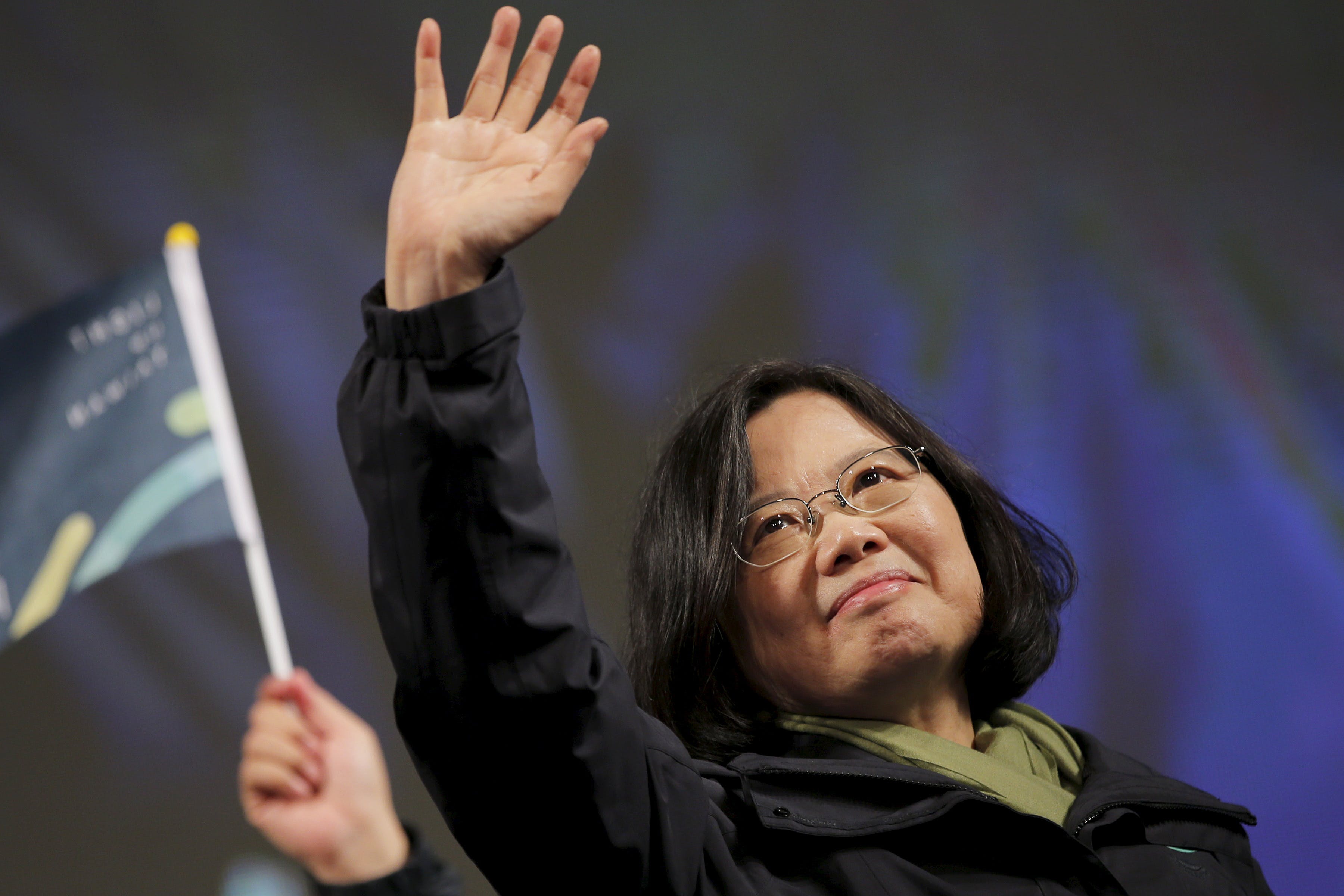 Democratic Progressive Party Chairperson and presidential candidate Tsai Ing-wen waves to supporters as they celebrate her election victory at the party's headquarters in Taipei, Taiwan