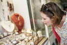 珠寶店＿Woman Looking at Jewelry in Case
