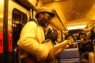 France Paris In the RER B, a crying baby, a musician comes, meeting tired and blasé eyes, but he starts to play, still smiling, Bob Marley variations. The baby stops crying at the first chords from "n