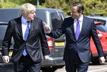 Britain's Prime Minister Cameron and London Mayor Johnson arrive at the Advantage children's daycare nursery in Surbiton in south west London