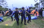 Police clean up Lung Wo Road in Hong Kong