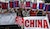 Filipino activists and Vietnamese nationals display placards and chant anti-China slogans as they march outside the Chinese Consulate in Manila