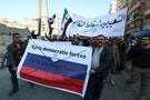 People attend a protest against forces loyal to Syria's President Assad, Russia and the Syrian Democratic forces, in Tariq al-Bab neighbourhood of Aleppo