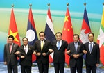 Leaders hold hands as they pose for pictures during Lancang-Mekong cooperation leaders' meeting in Sanya
