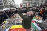 A man reacts at a street memorial following bomb attacks in Brussels, Belgium