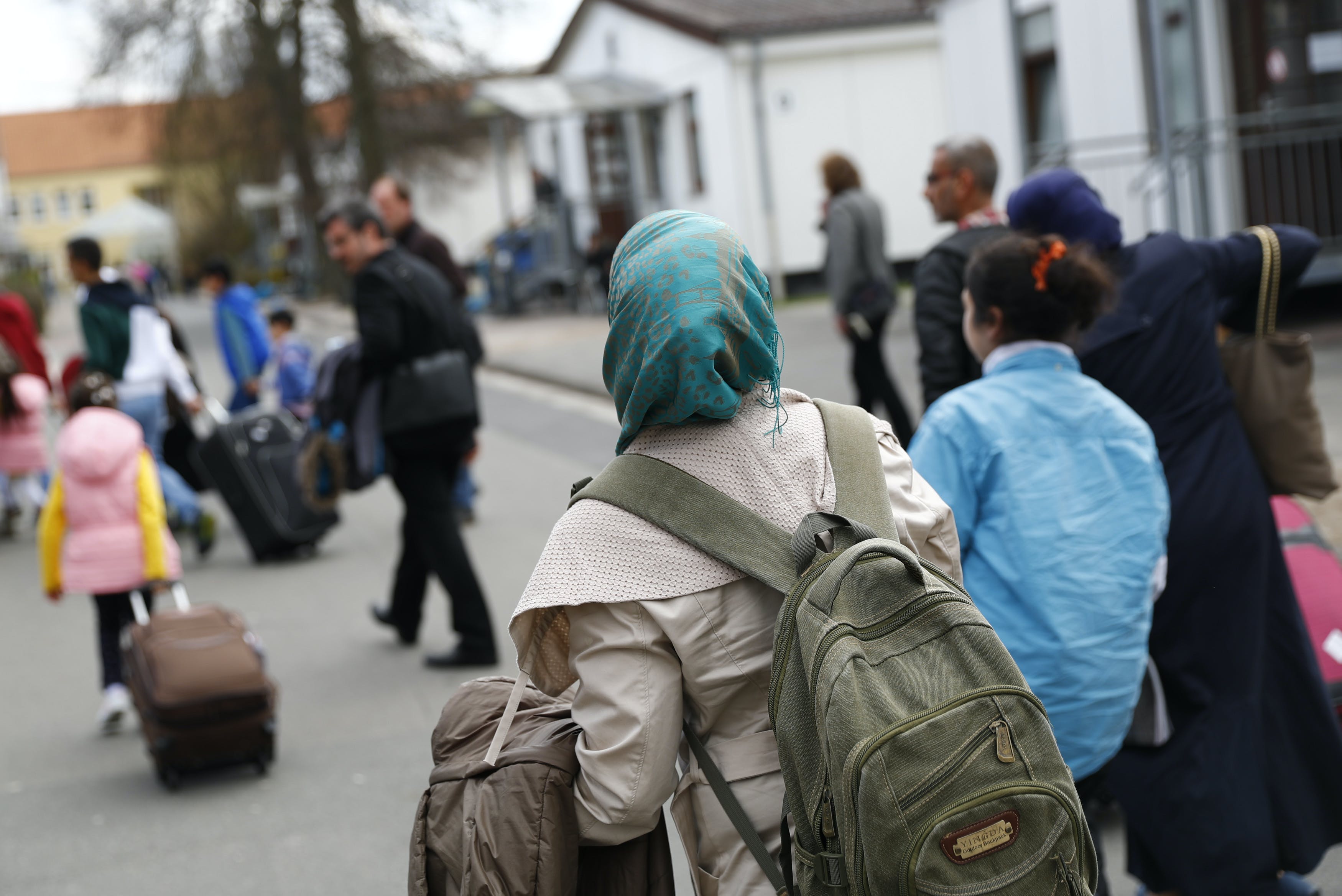 Syrian refugees arrive at the camp for refugees and migrants in Friedland