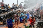 Elephants spray children with water during the celebration of the Songkran water festival in Thailand's Ayutthaya province, north of Bangkok, April 11, 2016. REUTERS/Jorge Silva - RTX29DO5