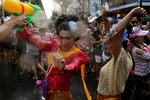 Revellers react during a water fight at Songkran Festival celebrations in Bangkok