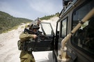 IDF Lieutenant-General David enters a jeep during an observation of the area where Israeli army is excavating part of a cliff to create an additional barrier along its border with Lebanon, near commun