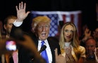 Republican U.S. presidential candidate and businessman Donald Trump waves after speaking to supporters following the results of the Indiana state primary at Trump Tower in Manhattan, New York