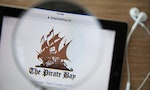 CHIANGMAI, THAILAND - February 26, 2015: Photo of the new Pirate Bay homepage on a ipad monitor screen through a magnifying glass.