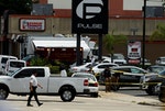 Police continue to investigate a shooting at the Pulse night club following an early morning shooting attack in Orlando, Florida