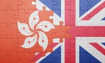 puzzle with the national flag of great britain and hong kong . concept