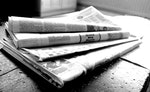Newspapers in black and white.