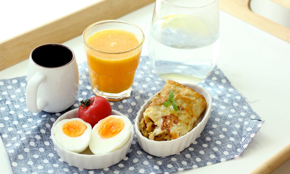 breakfast Morning w/ 3 cups  Warm lemon water, vegan-fruit juice, black coffee. Boiled egg, vegetable pancake roll.